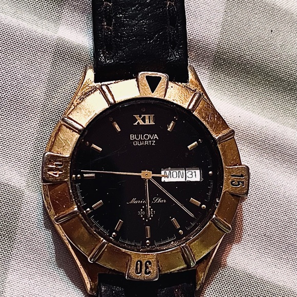 Bulova Black and Gold Luxury Watch Elegant Design